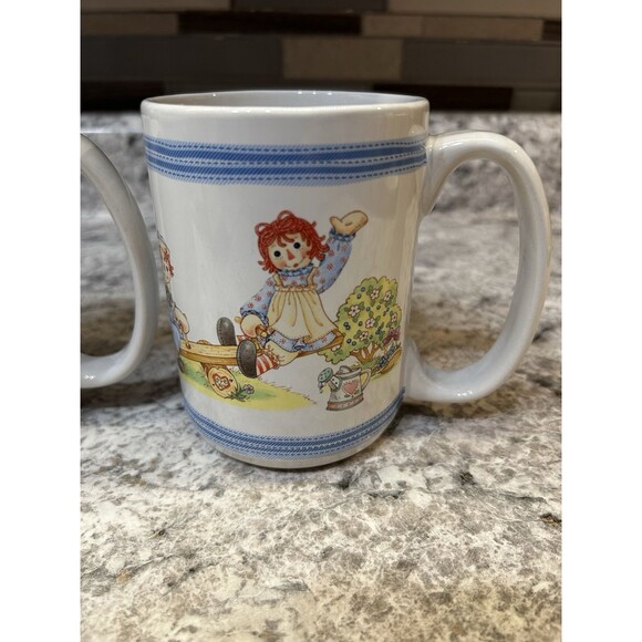 Raggedy Ann and Andy Waving Houston Harvest Cup Mug Coffee Tea Set of 2 - Picture 2 of 5